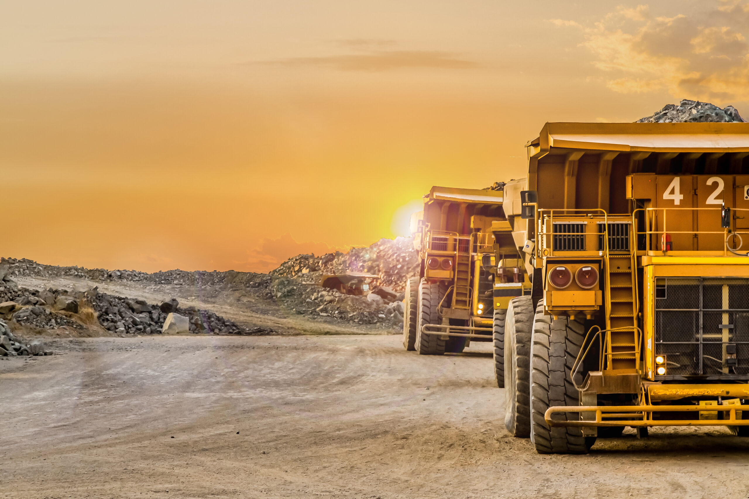 Dump Trucks transporting Platinum ore for processing